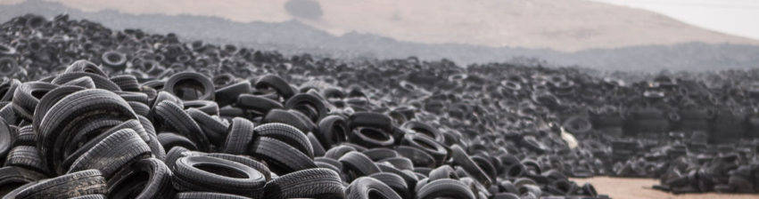 Pile of old tires laying in a landfill for recycling